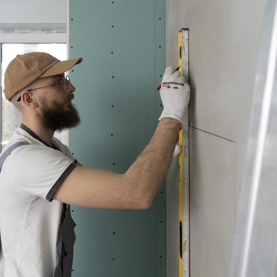 tiler-working-on-renovation-of-apartment